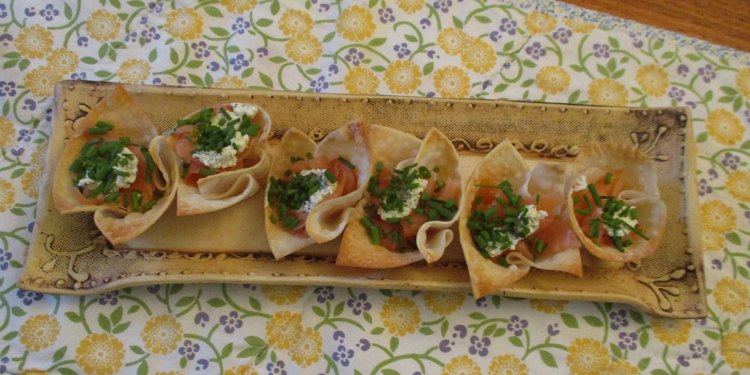 Wonton cups filled with smoked salmon and herbed cheese.